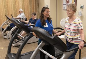 nurse with patient on a treadmill